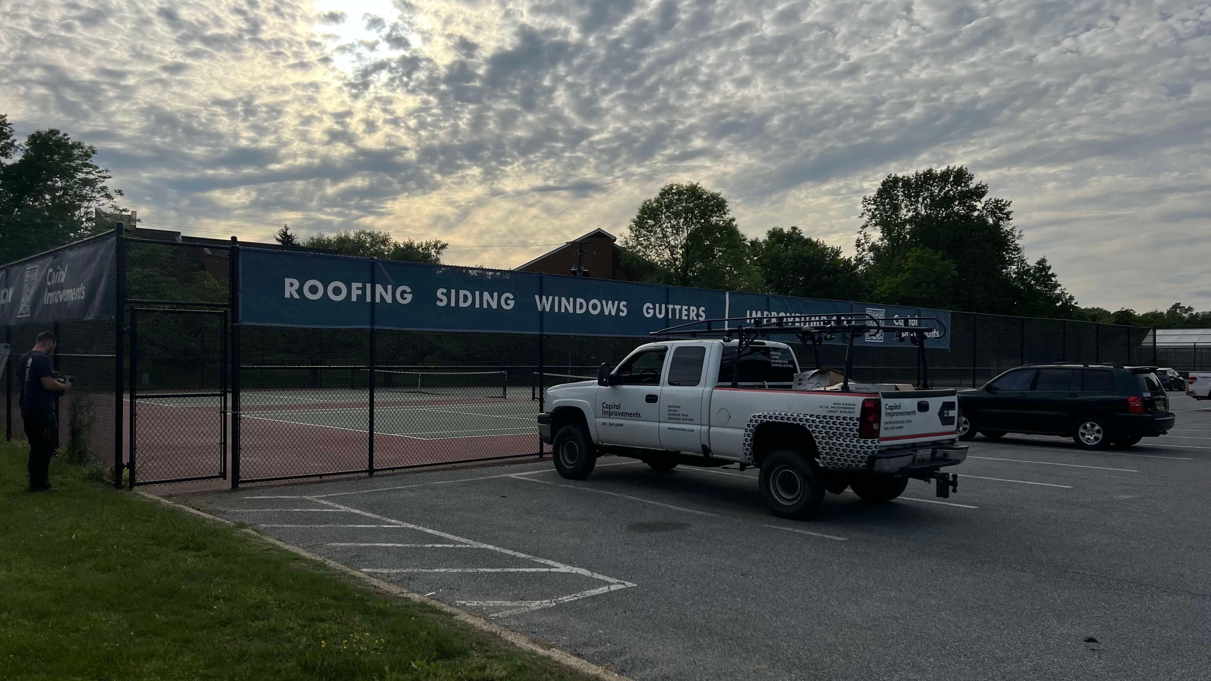 Capitol Improvements sign on the fence at Bowie High School in Bowie MD