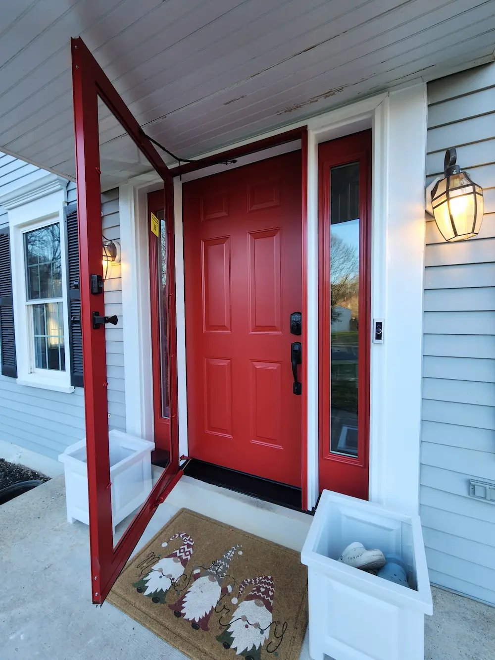 After photo of a Red Steel Door with Full View Glass Sidelites and a New Storm Door Installed in Gaithersburg MD